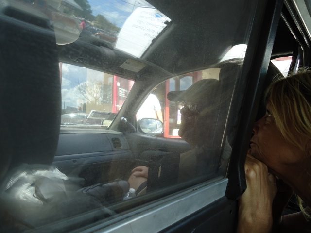 Bambi right next to me in the back of the police car. Brian in front.
