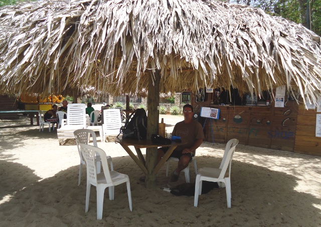 Chilling under a beach hut