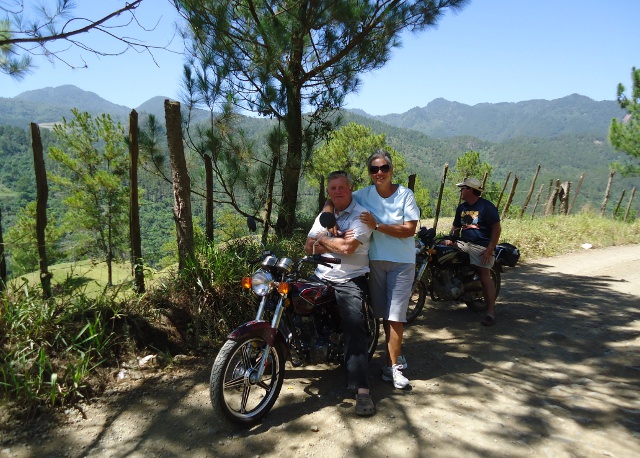 Bob and Georgette posing for me and Brian gazing at the mountains below