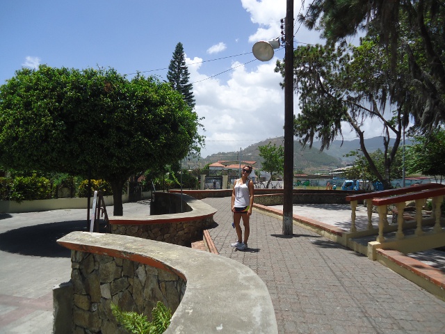 Parque Central, downtown Constanza, Rachel and pretty mountains in the background.