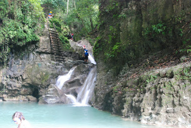 This is the base of waterfall one and two - it is a swimming hole that those waiting can swim at while waiting - in order to get up to the other waterfalls you must climb up the little waterfall on the left and then up the wooden ladder.
